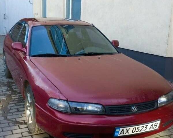 Красный Мазда 626, объемом двигателя 1.8 л и пробегом 257 тыс. км за 1200 $, фото 1 на Automoto.ua