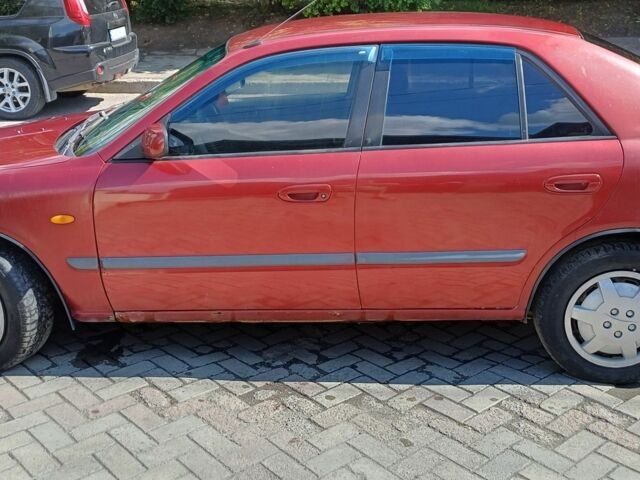 Красный Мазда 626, объемом двигателя 2 л и пробегом 400 тыс. км за 1429 $, фото 5 на Automoto.ua