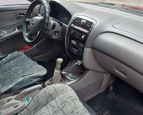 Красный Мазда 626, объемом двигателя 2 л и пробегом 246 тыс. км за 3700 $, фото 11 на Automoto.ua