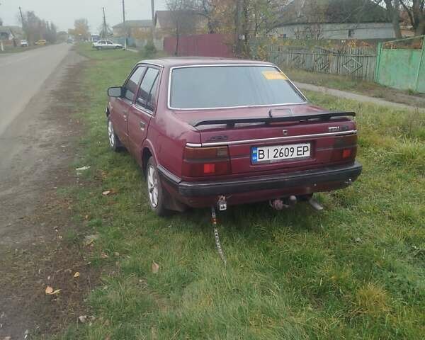 Красный Мазда 626, объемом двигателя 2 л и пробегом 300 тыс. км за 1000 $, фото 2 на Automoto.ua