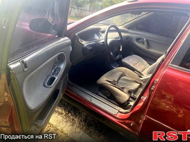 Красный Мазда 626, объемом двигателя 2 л и пробегом 258 тыс. км за 760 $, фото 1 на Automoto.ua