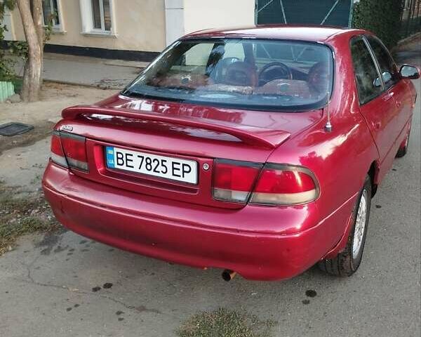 Красный Мазда 626, объемом двигателя 1.99 л и пробегом 245 тыс. км за 1600 $, фото 1 на Automoto.ua