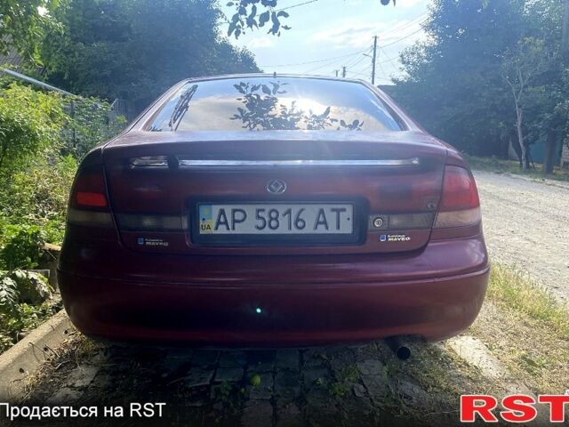 Красный Мазда 626, объемом двигателя 2 л и пробегом 258 тыс. км за 760 $, фото 2 на Automoto.ua