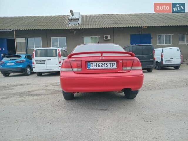 Красный Мазда 626, объемом двигателя 2 л и пробегом 210 тыс. км за 2600 $, фото 2 на Automoto.ua