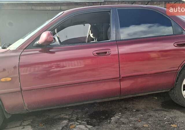 Красный Мазда 626, объемом двигателя 1.99 л и пробегом 380 тыс. км за 1500 $, фото 3 на Automoto.ua