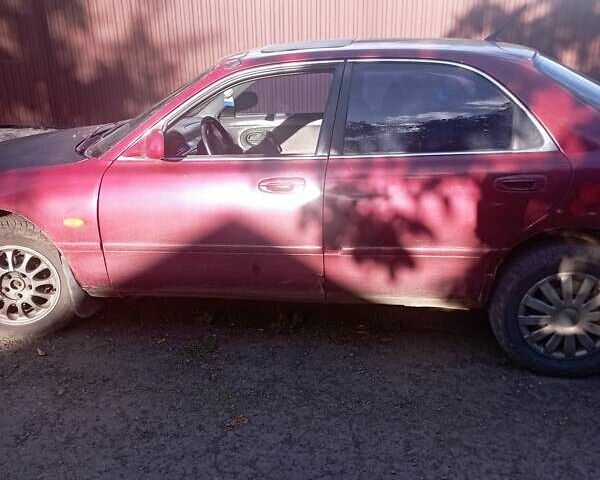 Красный Мазда 626, объемом двигателя 2 л и пробегом 440 тыс. км за 1857 $, фото 2 на Automoto.ua