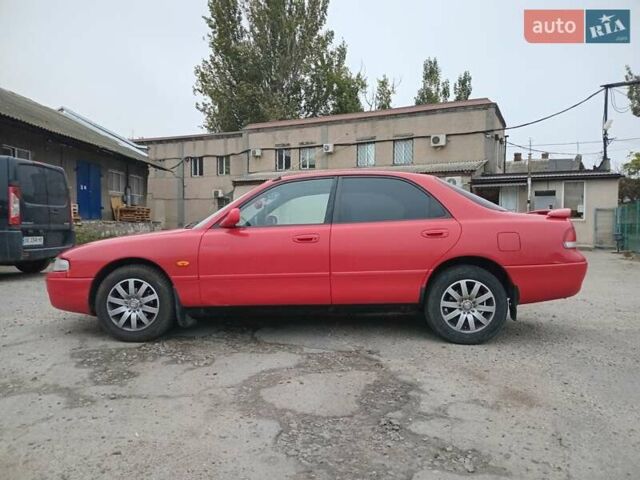 Красный Мазда 626, объемом двигателя 2 л и пробегом 210 тыс. км за 2600 $, фото 1 на Automoto.ua