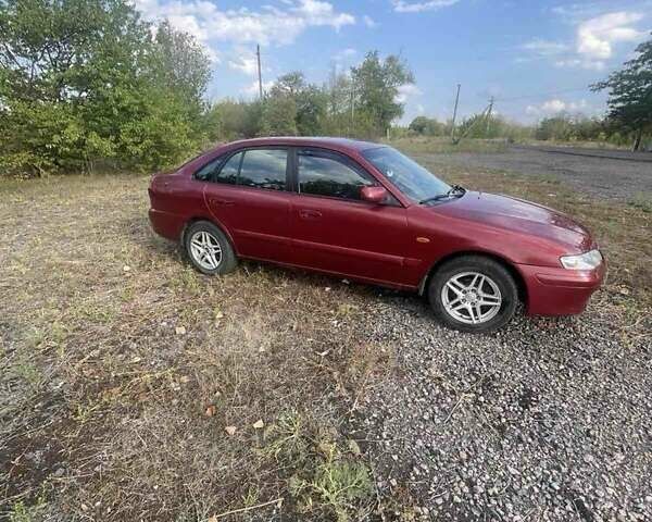 Красный Мазда 626, объемом двигателя 2 л и пробегом 307 тыс. км за 2999 $, фото 1 на Automoto.ua