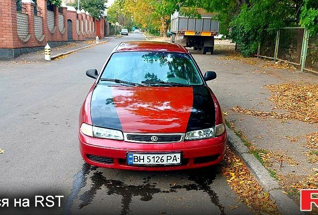 Красный Мазда 626, объемом двигателя 2 л и пробегом 320 тыс. км за 1500 $, фото 1 на Automoto.ua