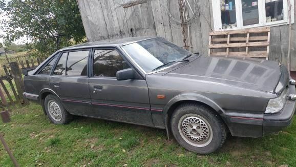 Серый Мазда 626, объемом двигателя 2 л и пробегом 210 тыс. км за 1000 $, фото 1 на Automoto.ua