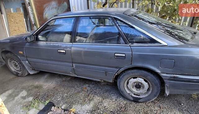 Серый Мазда 626, объемом двигателя 2 л и пробегом 396 тыс. км за 800 $, фото 2 на Automoto.ua