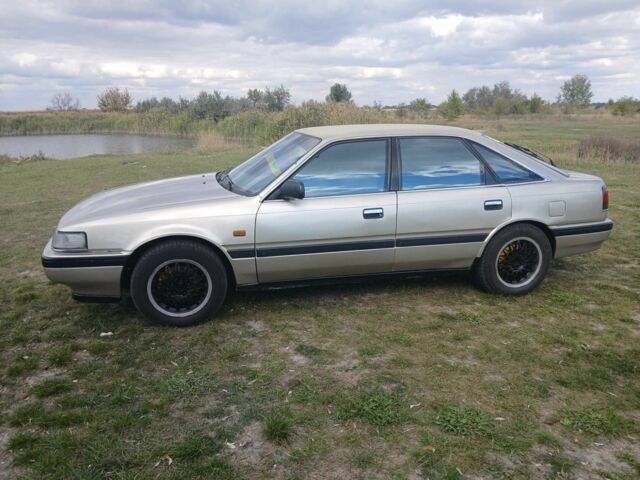 Серый Мазда 626, объемом двигателя 2 л и пробегом 320 тыс. км за 2022 $, фото 1 на Automoto.ua