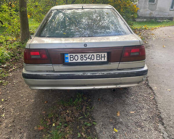 Серый Мазда 626, объемом двигателя 2 л и пробегом 355 тыс. км за 1000 $, фото 1 на Automoto.ua