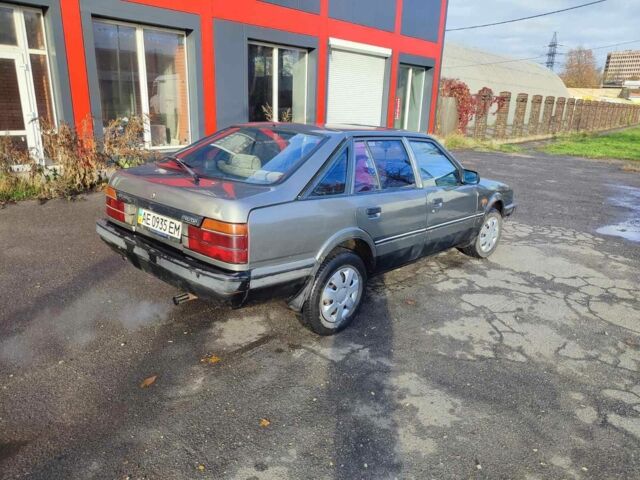 Серый Мазда 626, объемом двигателя 2 л и пробегом 200 тыс. км за 750 $, фото 3 на Automoto.ua