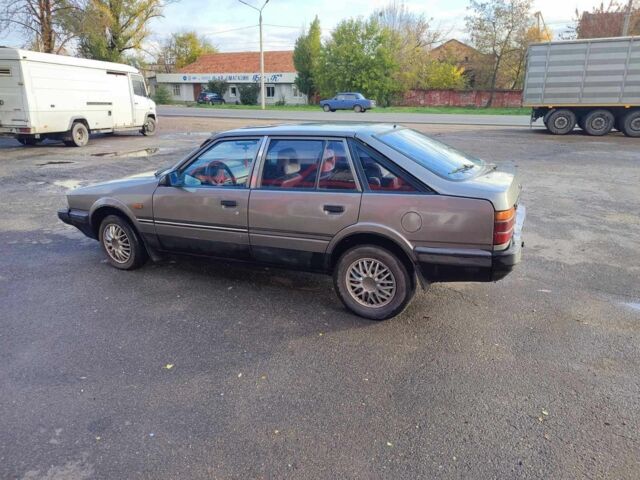 Серый Мазда 626, объемом двигателя 2 л и пробегом 200 тыс. км за 750 $, фото 2 на Automoto.ua