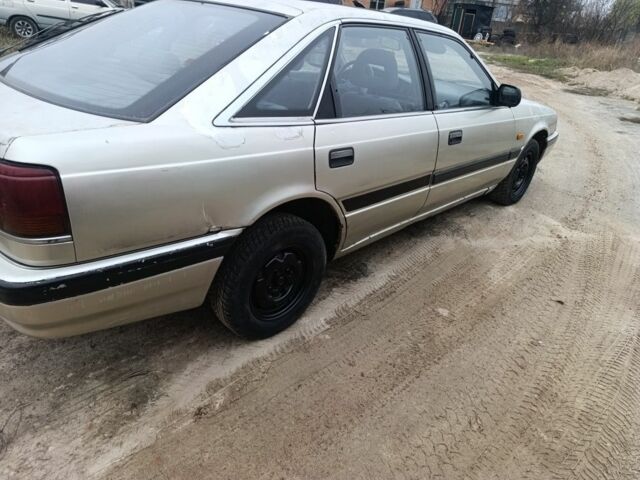 Серый Мазда 626, объемом двигателя 2 л и пробегом 280 тыс. км за 1300 $, фото 2 на Automoto.ua