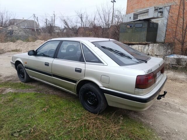 Серый Мазда 626, объемом двигателя 2 л и пробегом 280 тыс. км за 1300 $, фото 3 на Automoto.ua