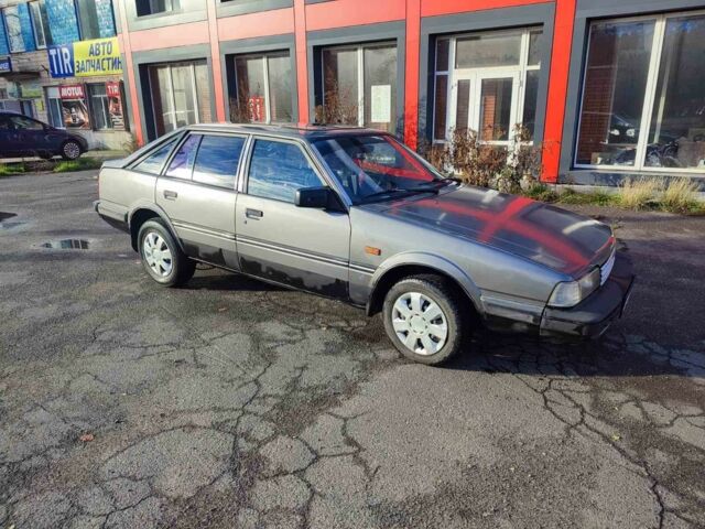 Серый Мазда 626, объемом двигателя 2 л и пробегом 200 тыс. км за 750 $, фото 1 на Automoto.ua