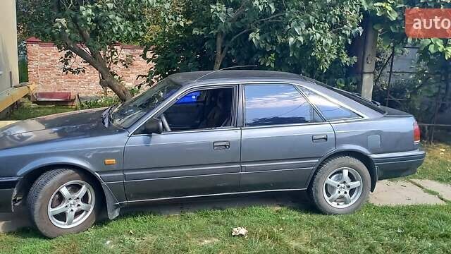 Серый Мазда 626, объемом двигателя 2 л и пробегом 300 тыс. км за 1900 $, фото 1 на Automoto.ua