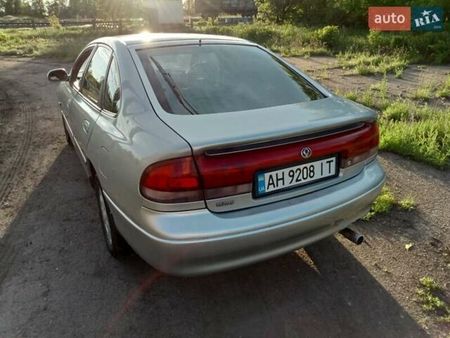 Серый Мазда 626, объемом двигателя 2 л и пробегом 490 тыс. км за 2200 $, фото 1 на Automoto.ua