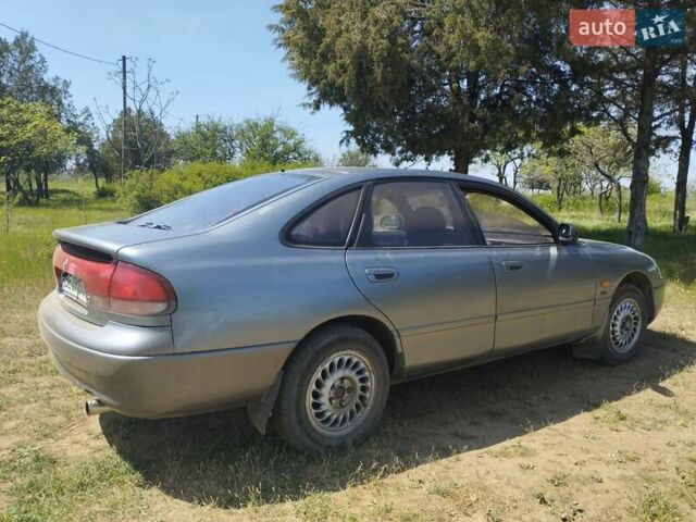 Сірий Мазда 626, об'ємом двигуна 1.84 л та пробігом 500 тис. км за 1999 $, фото 4 на Automoto.ua
