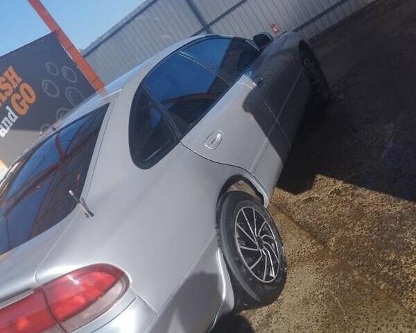 Серый Мазда 626, объемом двигателя 2 л и пробегом 121 тыс. км за 1999 $, фото 1 на Automoto.ua