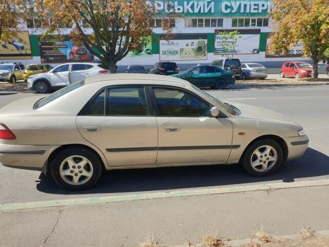 Серый Мазда 626, объемом двигателя 2 л и пробегом 400 тыс. км за 900 $, фото 1 на Automoto.ua