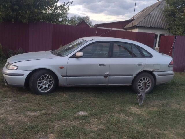 Серый Мазда 626, объемом двигателя 2 л и пробегом 250 тыс. км за 800 $, фото 2 на Automoto.ua