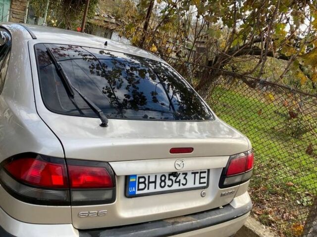 Серый Мазда 626, объемом двигателя 2 л и пробегом 312 тыс. км за 3399 $, фото 3 на Automoto.ua