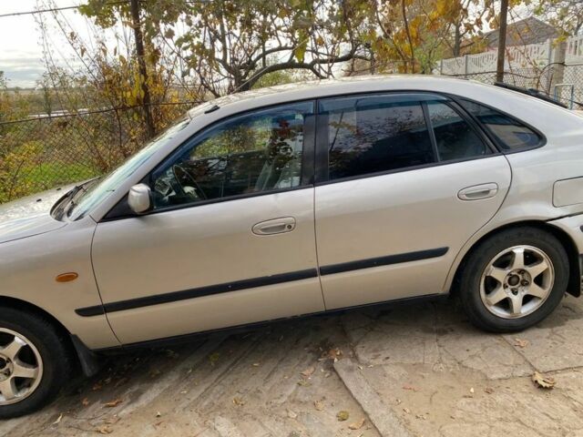 Серый Мазда 626, объемом двигателя 2 л и пробегом 312 тыс. км за 3399 $, фото 2 на Automoto.ua