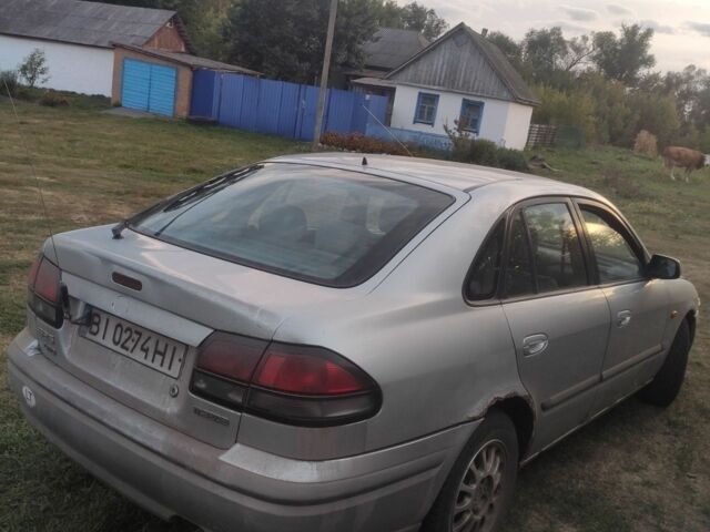 Серый Мазда 626, объемом двигателя 2 л и пробегом 250 тыс. км за 800 $, фото 4 на Automoto.ua