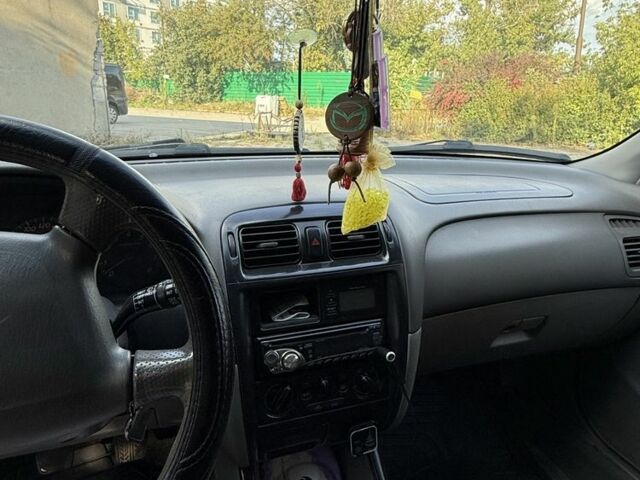 Серый Мазда 626, объемом двигателя 1.8 л и пробегом 299 тыс. км за 2400 $, фото 2 на Automoto.ua