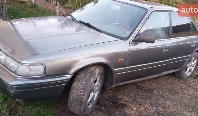 Серый Мазда 626, объемом двигателя 2 л и пробегом 384 тыс. км за 1000 $, фото 1 на Automoto.ua