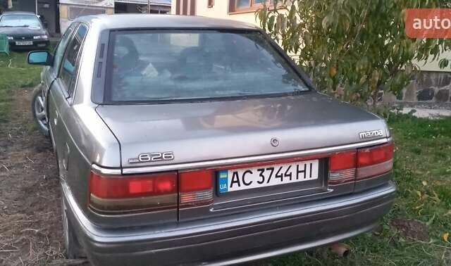 Серый Мазда 626, объемом двигателя 2 л и пробегом 384 тыс. км за 1000 $, фото 2 на Automoto.ua
