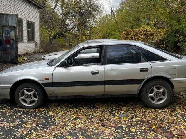 Серый Мазда 626, объемом двигателя 2 л и пробегом 200 тыс. км за 950 $, фото 1 на Automoto.ua