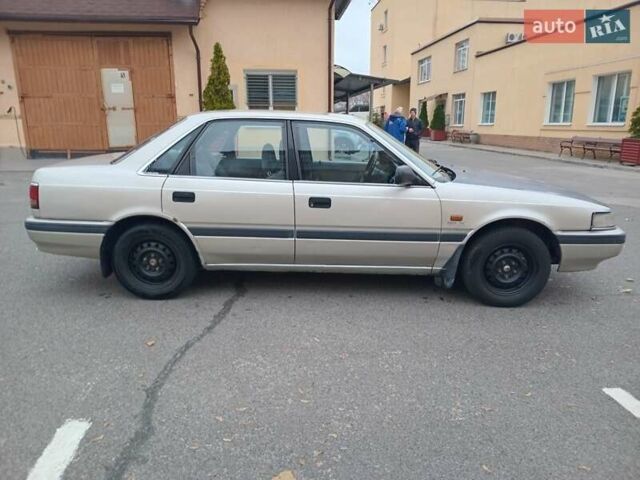 Серый Мазда 626, объемом двигателя 2 л и пробегом 449 тыс. км за 1300 $, фото 2 на Automoto.ua