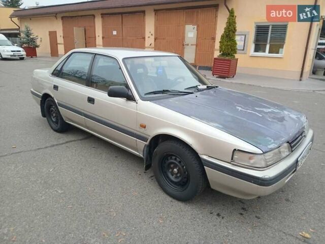 Серый Мазда 626, объемом двигателя 2 л и пробегом 449 тыс. км за 1300 $, фото 1 на Automoto.ua