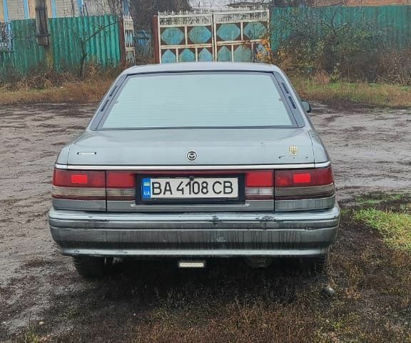 Серый Мазда 626, объемом двигателя 2 л и пробегом 400 тыс. км за 1547 $, фото 2 на Automoto.ua