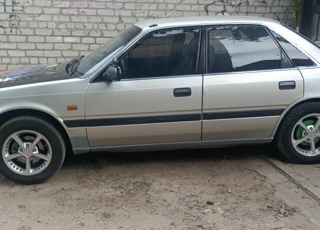 Серый Мазда 626, объемом двигателя 2 л и пробегом 400 тыс. км за 961 $, фото 1 на Automoto.ua