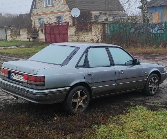 Серый Мазда 626, объемом двигателя 2 л и пробегом 400 тыс. км за 1547 $, фото 1 на Automoto.ua