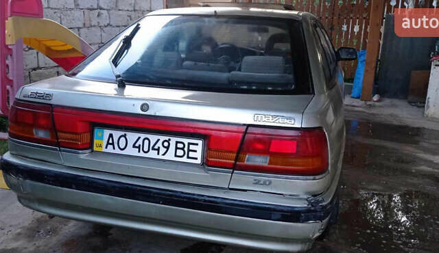 Серый Мазда 626, объемом двигателя 2 л и пробегом 322 тыс. км за 650 $, фото 1 на Automoto.ua