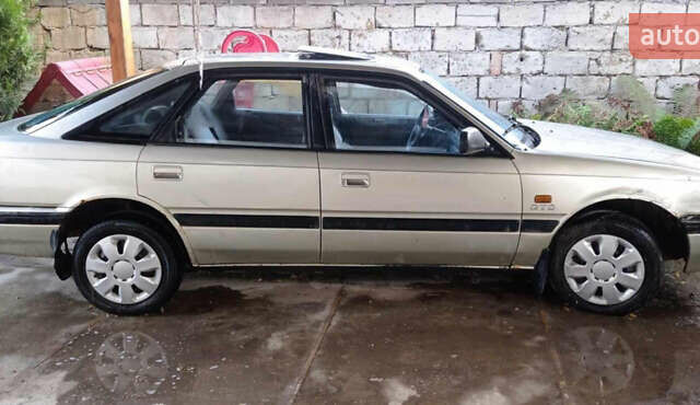 Серый Мазда 626, объемом двигателя 2 л и пробегом 322 тыс. км за 650 $, фото 3 на Automoto.ua