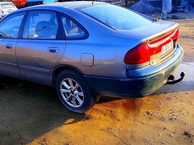 Серый Мазда 626, объемом двигателя 2 л и пробегом 300 тыс. км за 1650 $, фото 2 на Automoto.ua