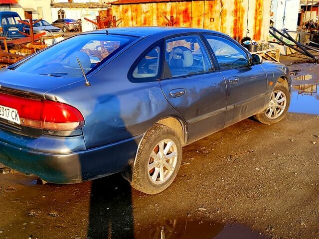 Серый Мазда 626, объемом двигателя 2 л и пробегом 300 тыс. км за 1650 $, фото 4 на Automoto.ua