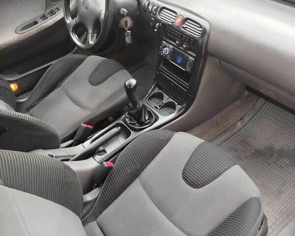 Серый Мазда 626, объемом двигателя 2 л и пробегом 320 тыс. км за 2000 $, фото 5 на Automoto.ua