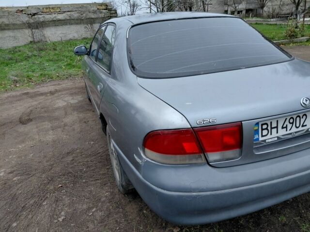 Серый Мазда 626, объемом двигателя 2 л и пробегом 297 тыс. км за 1700 $, фото 1 на Automoto.ua