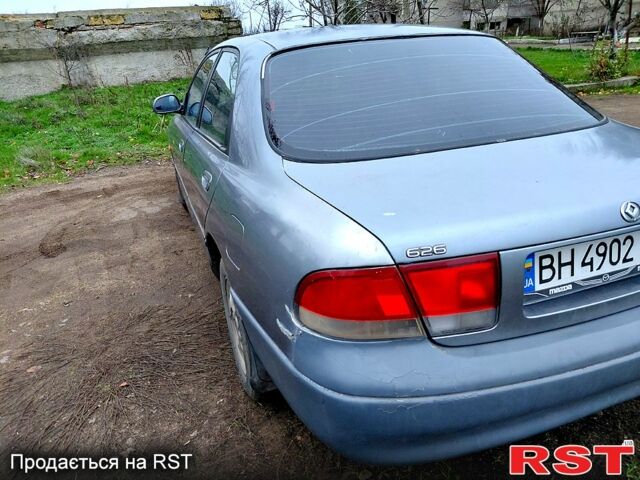 Серый Мазда 626, объемом двигателя 2 л и пробегом 297 тыс. км за 1600 $, фото 4 на Automoto.ua