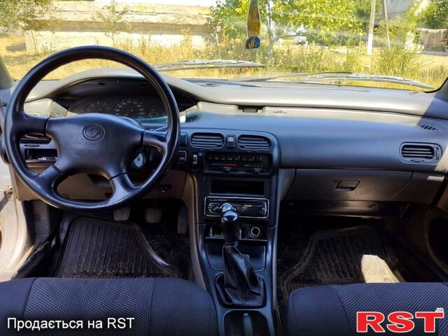 Серый Мазда 626, объемом двигателя 2 л и пробегом 297 тыс. км за 1600 $, фото 1 на Automoto.ua