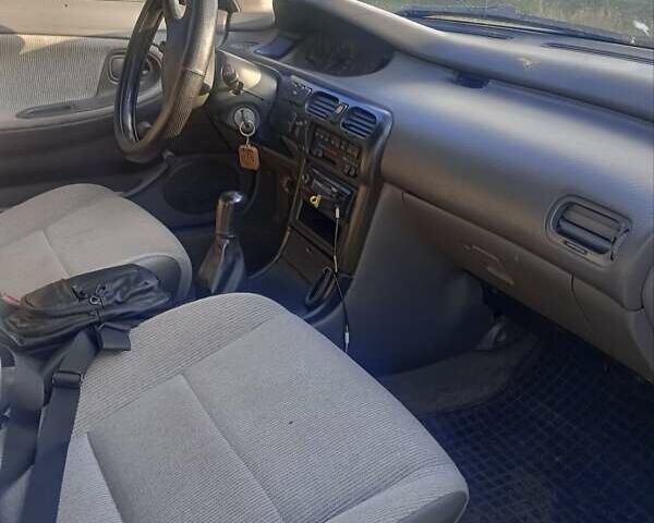 Серый Мазда 626, объемом двигателя 1.8 л и пробегом 230 тыс. км за 2500 $, фото 2 на Automoto.ua