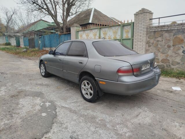 Серый Мазда 626, объемом двигателя 2 л и пробегом 100 тыс. км за 1000 $, фото 2 на Automoto.ua